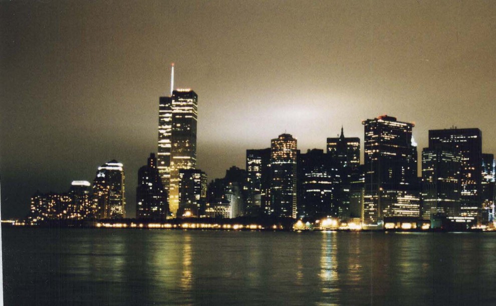 Night view of the illuminated lower Manhattan skyline. 1995.