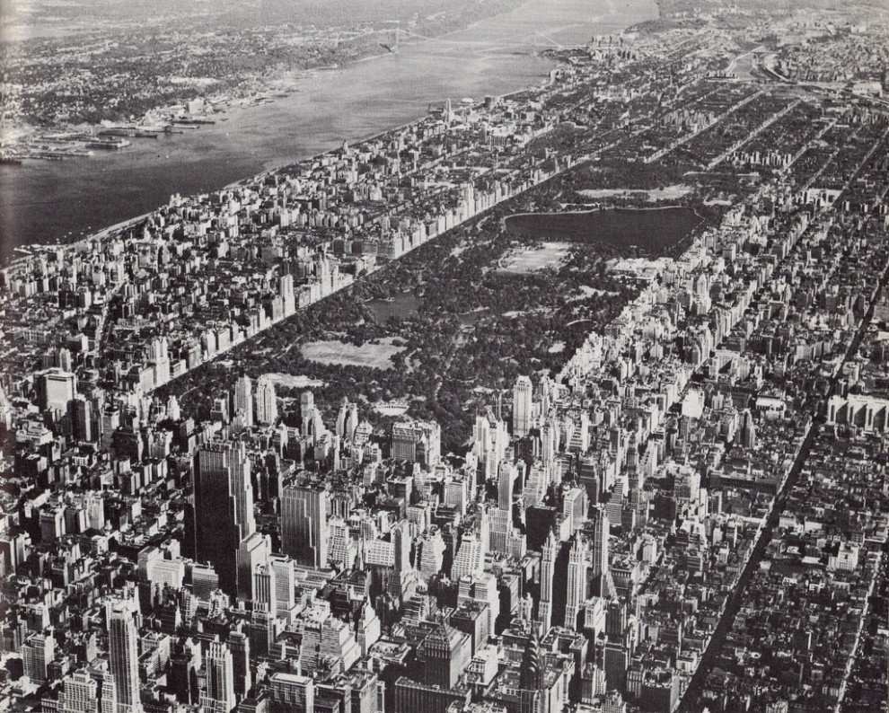 Aerial view of Midtown Manhattan looking northwest showing Central Park. August 1955.