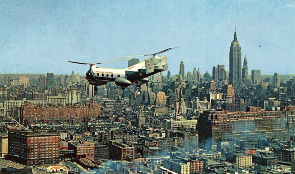 A helicopter flies over Midtown Manhattan in May 1958.