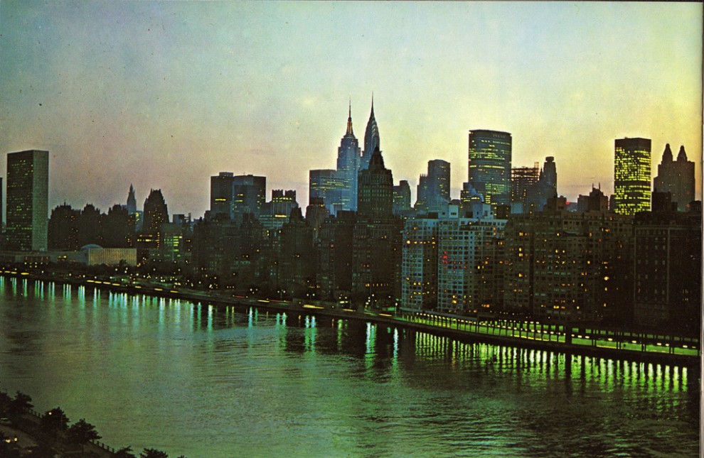 Night view of Midtown Manhattan looking southwest from Queensboro Bridge. June 1963.