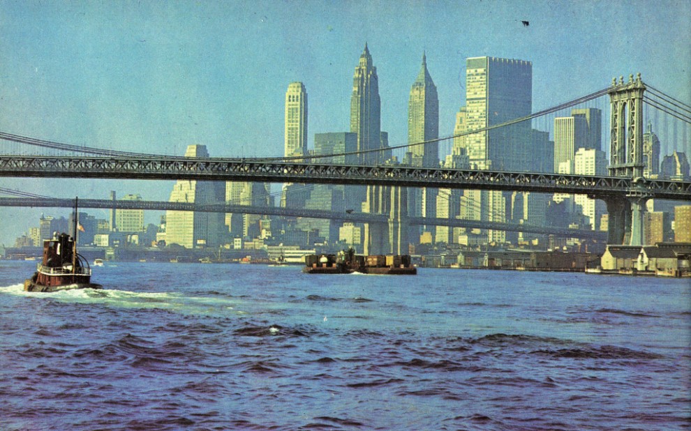 Lower Manhattan and Brooklyn and Manhattan bridges viewed from East River looking southwest in July 1965.