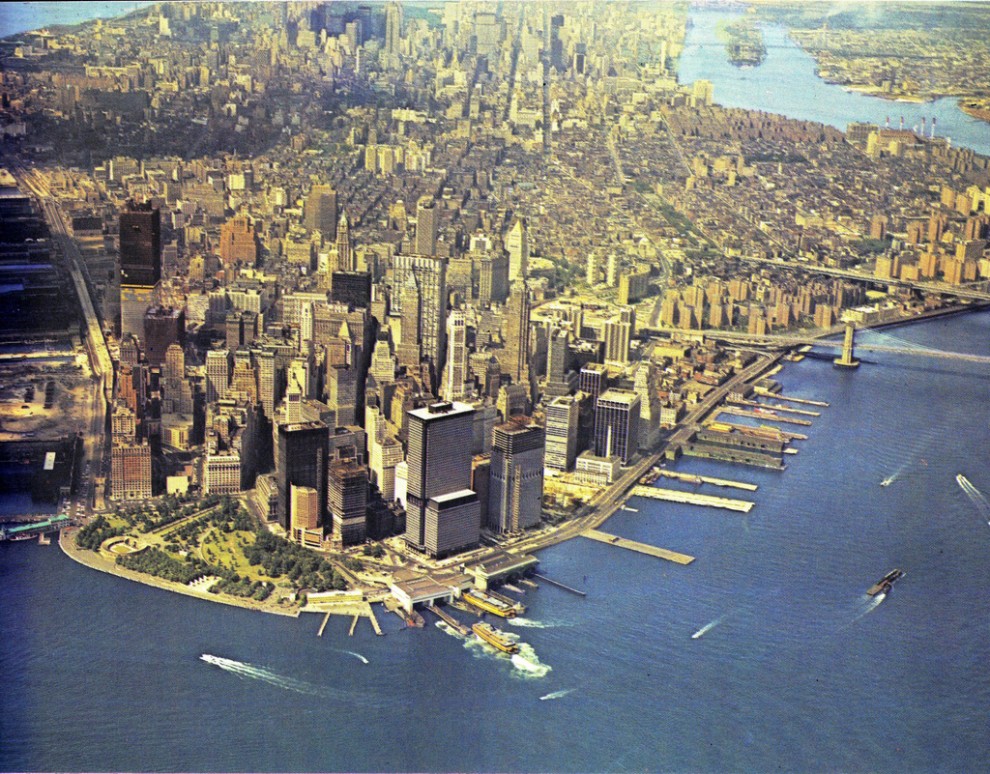Aerial view of Manhattan Island looking north. May 1970. Construction of the World Trade Center is at an advanced stage.