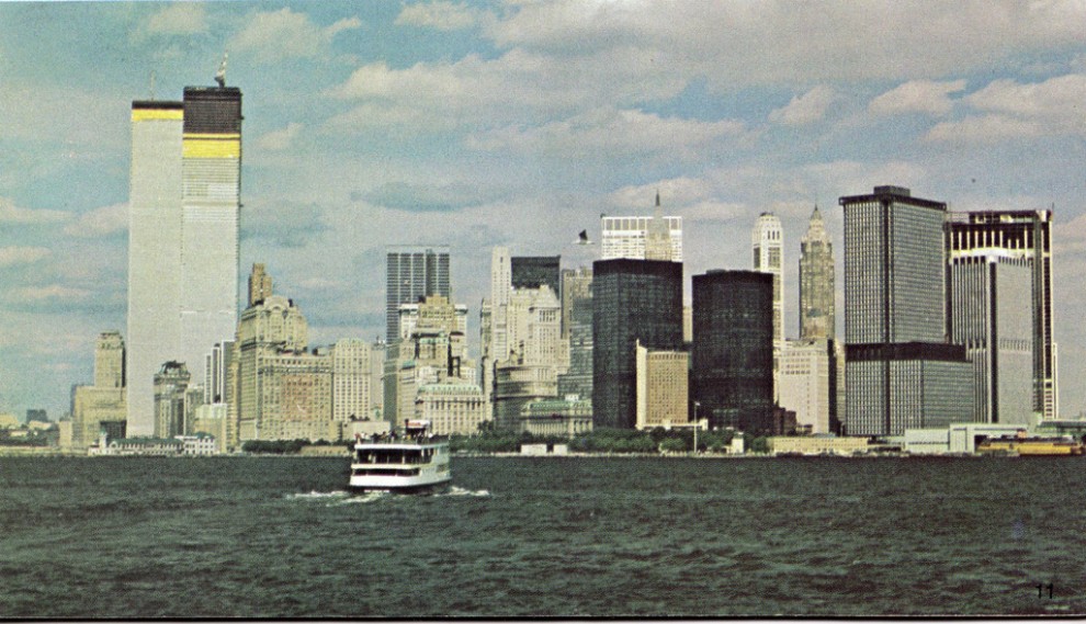 Lower Manhattan skyline looking north from Staten Island ferry, with the 110-story Twin Towers of the World Trade Center nearing completion. March 1972.