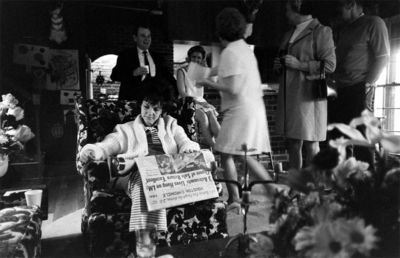 Marilyn Lovell, wife of Apollo 13 commander Jim Lovell, reads newspaper with Apollo 13 news on front page while at home. April 1970.