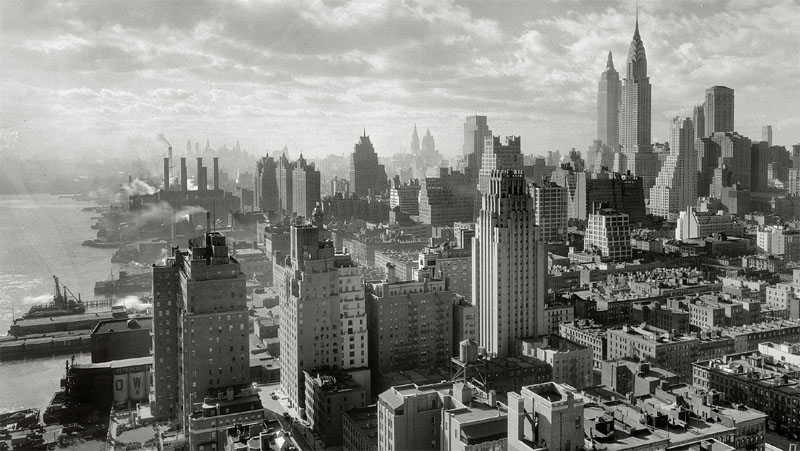 The completed Empire State Building standing at 1,250 feet (380 m) and Chrysler building loom large over Manhattan (1932)