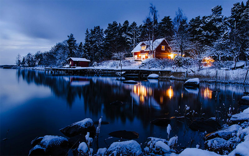 snowy house by the lake