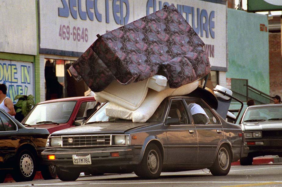 Car carries looted furniture during the LA riots of 1992.
