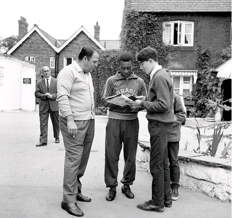 Pele signing autographs for fans during the 1966 World Cup in England.