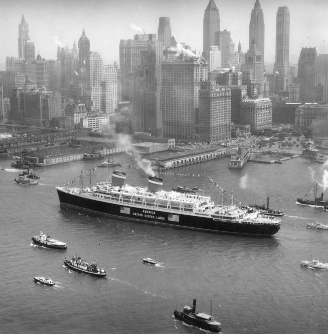 The S.S. America (built in 1940, the same year this photo was taken) makes its way up the busy Hudson River.