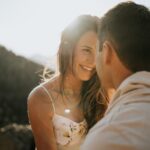 man and woman kissing during daytime